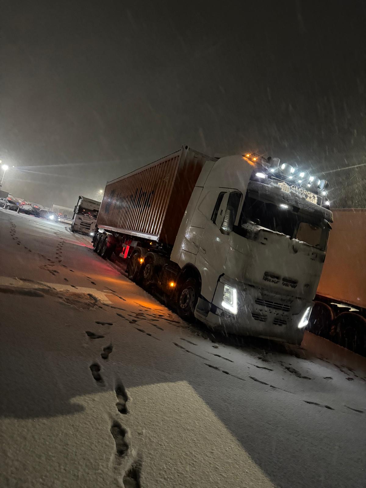 George's Haulage truck working in the snow at night
